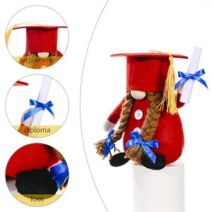 Red graduation gnome with bachelor cap and diploma certificate on white display stand