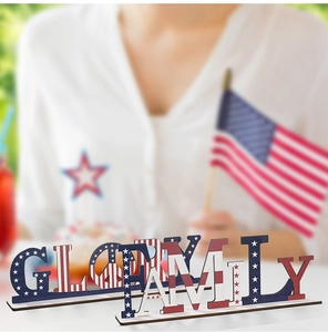 Detail of wooden Glory and Family letter signs with American flag stars and stripes design