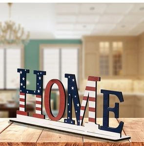 Macro detail of wooden HOME sign with American flag pattern on a rustic table