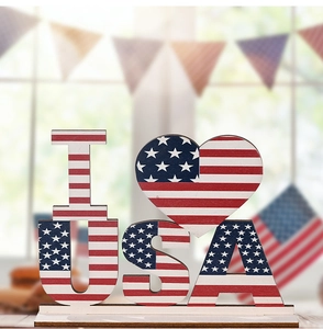 Detailed view of 'I Love USA' wooden ornament with American flag pattern on a base