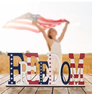 Detail of wooden Freedom letter plaque with American flag print for patriotic desk decor