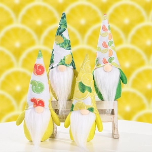 Detailed view of four lemon-themed gnome plush toys on a wooden display stand