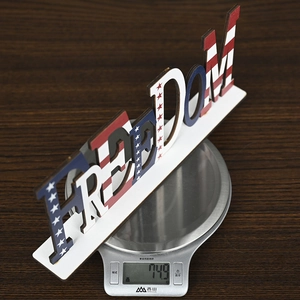 Side view of Independence Day FREEDOM wooden sign showing texture and 74.9g weight