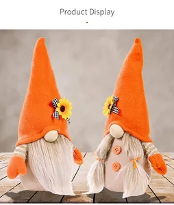 Detailed view of harvest sunflower gnomes with plush textures and autumn bows