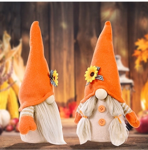 Close-up of autumn harvest gnomes featuring sunflowers and warm orange felt details