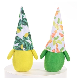 Detail of fruit themed gnome plush set with lemon and orange felt hats on white base