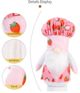 Detail display of strawberry gnome plush with pink patterned chef hat and white whiskers