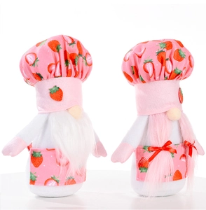 Detail of plush strawberry chef gnomes featuring soft fabric textures and cute patterns