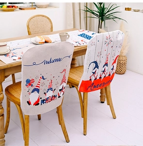 Detail of American Independence Day chair covers and table runner with festive gnomes