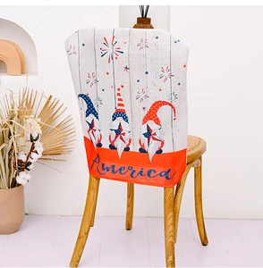 Detail of USA Independence Day chair cover featuring gnomes and America text on burlap