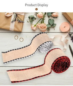 Detail of burlap textured ribbons with plaid edges for festive gift wrapping and DIY crafts