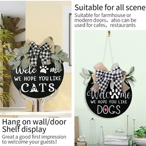 Rustic wooden welcome signs for dogs and cats with buffalo plaid bows and greenery