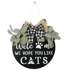 Round wooden Welcome sign with cat silhouette, checkered bow and greenery for wall decor