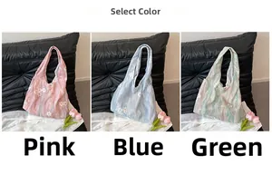 Three embroidered floral tote bags in pink, blue and green with wavy texture details