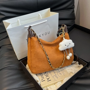 Brown suede Hobo tote bag with chain strap and cloud charm in a gift box