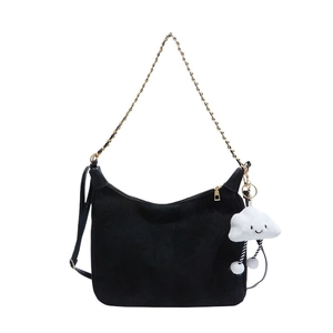 Large black hobo tote bag with gold chain strap and a white cloud plush charm