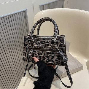 Leopard print small crossbody bag with iconic smile design and detachable strap