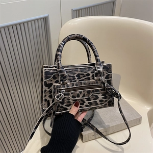 French retro leopard print handbag with white piping and crossbody strap for winter 2025
