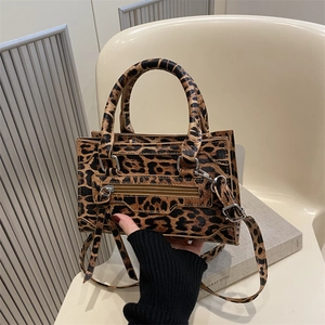 Leopard print trapezoid handbag with silver hardware and detachable strap