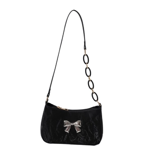 Chic black wrinkled underarm bag featuring a silver bow and metal chain strap accent