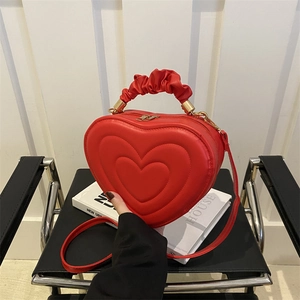 Red heart-shaped handbag with pleated cloud handle and embossed pattern for women