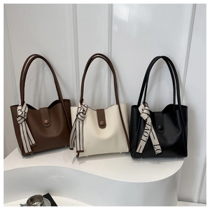 Minimalist tote bags in brown, beige, and black colors with decorative silk scarves