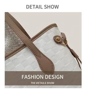 Close-up of cream checkered texture tote bag with brown leather trim and gold metal ring