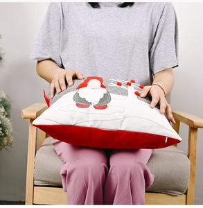 Detail of Nordic Christmas gnome cushion cover with 3D pom-poms and hidden zipper