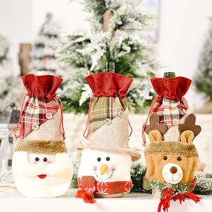 Detailed view of Christmas burlap wine bottle covers with Santa, Snowman and Reindeer