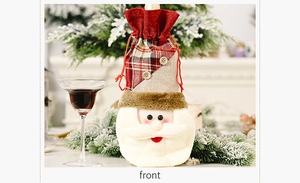 Detailed view of burlap Santa wine bottle cover with plaid fabric and wooden buttons