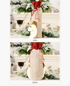 Detail view of burlap Christmas wine bottle cover with 3D Santa Claus and plaid pattern