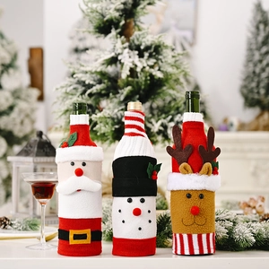 Three-piece Christmas wine bottle covers featuring Santa, snowman, and reindeer figures