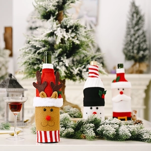 Christmas wine bottle covers featuring knitted Santa, reindeer, and snowman holiday designs