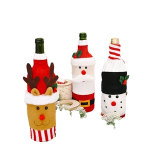 Christmas knit wine bottle covers featuring Santa, elk and snowman designs on white background