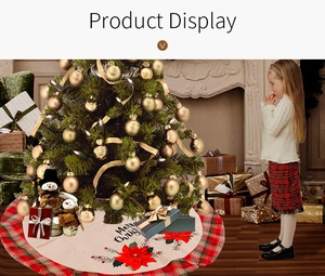 Cozy indoor scene of a rustic linen Christmas tree skirt with red poinsettia and plaid edge