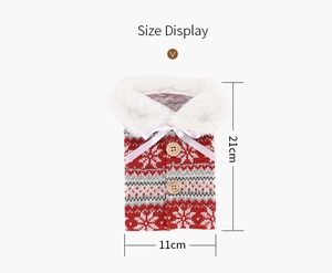Size display of a knitted Christmas wine bottle cover with red snowflakes and white fur collar