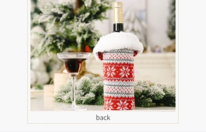Detail of Christmas wine bottle cover with red snowflake knit and faux fur trim