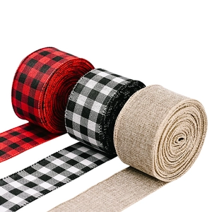 Close-up of red, black, and natural burlap plaid ribbons for Christmas decor