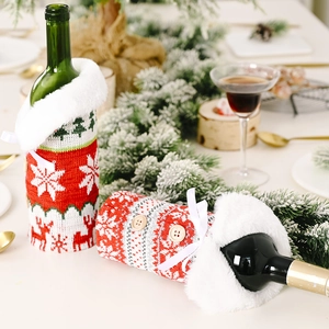 Christmas knit wine bottle covers with reindeer and snowflake patterns and white fur collar