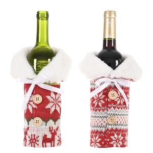 Christmas knitted wine bottle covers with snowflake patterns and faux fur collars
