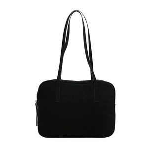 Minimalist black square shoulder bag with long straps and zipper closure on white background