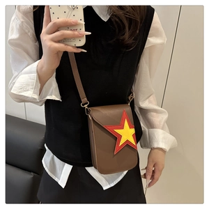 Detail of a brown PU leather phone bag featuring a red and yellow star decoration