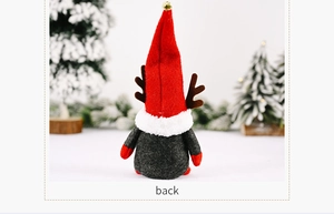 Rear view of Christmas gnome plush with red felt hat, brown reindeer antlers and gold bell