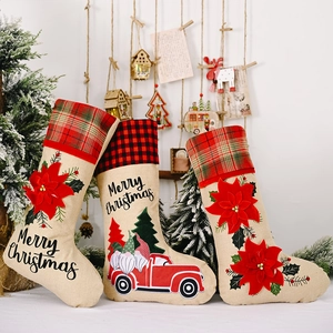 Three-piece burlap Christmas stockings set with red flower and Santa truck patterns