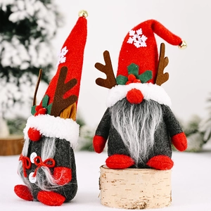 Christmas gnome set with reindeer antlers and snowflakes on white birch logs