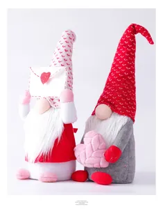 Close-up of handmade Valentine's gnomes featuring heart-patterned hats and plush textures