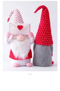 Detail of two Valentine plush gnomes with knitted hats and a heart envelope on white back