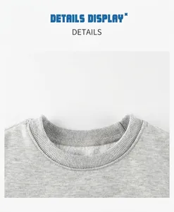 Détail du col rond côtelé d'un sweat gris avec une doublure en polaire blanche chaude