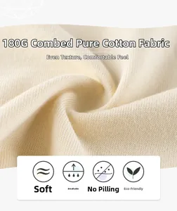 Macro shot of 180G beige combed cotton fabric showing smooth knit texture and soft drape