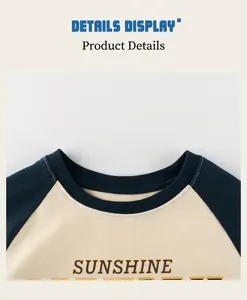 Detail of crew neck stitching on navy and cream raglan sleeve cotton t-shirt